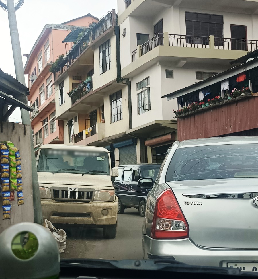 The streets of Nagaland are not new to the menace of haphazard, unauthorized parking. In one such case, a randomly parked vehicle in the Naga Bazaar area in Kohima resulted in the obstruction of smooth flow of traffic on July 26. Several vehicles were reportedly stuck in the congestion along the narrow street. According to the New Motor Vehicle Act 2019, parking of vehicles in public places where it may cause obstruction, inconvenience, or puts other people in danger is subject to penalty. However, in many places, ignorance and ineffective implementation of the law have resulted in traffic and parking woes across the State. Authorities also need to take into account the rising number of vehicles and come up with an effective system to regulate such recurring issues. Some mechanisms like awareness drives, stricter rules and enforcement, congestion taxes etc could be taken into consideration. (Photo Courtesy: Nijilo Kent)